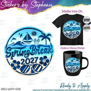 May include: A circular graphic design featuring the text Spring Break 2027 with illustrations of a sailboat, palm tree, sun, waves, hibiscus flowers, and sunglasses. The design is shown applied to a black t-shirt and a black ceramic mug.