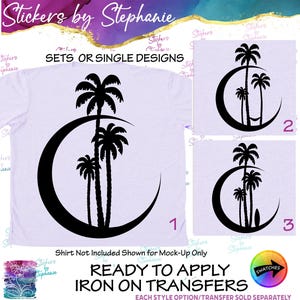 May include: A light purple t-shirt featuring a black graphic of three palm trees silhouetted against a crescent moon. Two additional variations are shown: one with a hammock between the trees and another with a surfboard leaning against the trunk.