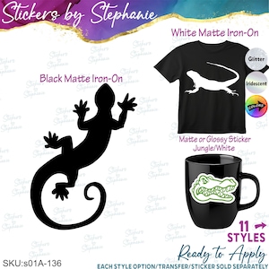 May include: A black matte iron-on lizard decal, a black t-shirt with a white lizard graphic, and a black mug featuring a green alligator head sticker. Text includes Stickers by Stephanie, White Matte Iron-On, and SKU:s01A-136.
