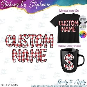 May include: A custom name design featuring red and white buffalo plaid lettering, shown as a large graphic, on a black t-shirt, and on a black mug. The text reads CUSTOM NAME in a bold font. Additional labels indicate matte iron-on and sticker options.
