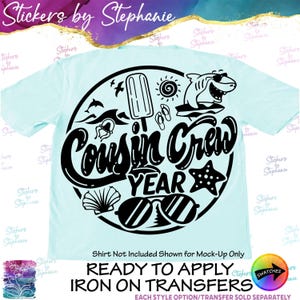 May include: A light blue t-shirt featuring a black circular graphic with the text Cousin Crew Year. The design includes a popsicle, a shark wearing sunglasses, a sun, flip-flops, a jellyfish, a starfish, a seashell, and a pair of sunglasses.