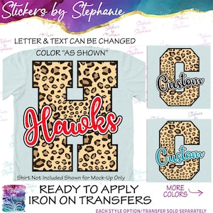 May include: A light blue t-shirt mock-up featuring a large letter "H" with a leopard print design and the word "Hawks" in red script. The text "Letter & Text Can Be Changed" is above the shirt. Additional designs with the word "Custom" are also shown.