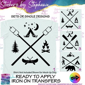 May include: A light-colored t-shirt featuring a black graphic of two crossed roasting sticks with marshmallows, a tent, a crescent moon, stars, a pine tree, a campfire, and a canoe with paddles. Four numbered square design options are displayed.