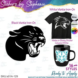 May include: A graphic design featuring a snarling panther head in black matte iron-on material, a black t-shirt with a white panther head graphic, and a black mug with a teal and white panther face sticker, labeled with text including Stickers by Stephanie.