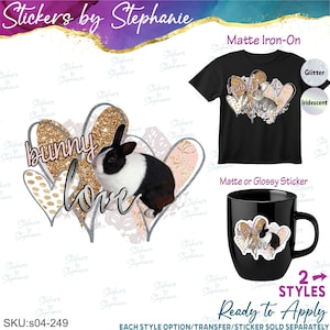 May include: A design featuring a black and white rabbit with gold glitter hearts and the text bunny love. The design is shown applied to a black t-shirt and a black mug. The image includes labels for matte iron-on, glitter, iridescent, and sticker.