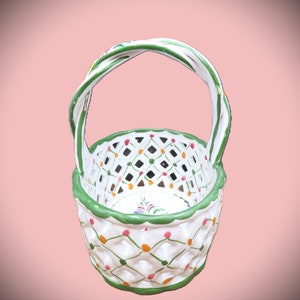 May include: White ceramic basket with a green handle and a lattice pattern. The basket is decorated with small red, green, and orange dots.