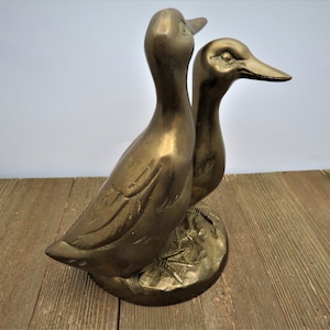 Two Brass Ducks/Geese on a Round Brass Base