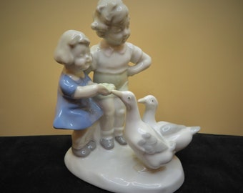 Porcelain Boy and Girl Feeding Ducks 5 1/4" tall Figurine Crown Mark GOR