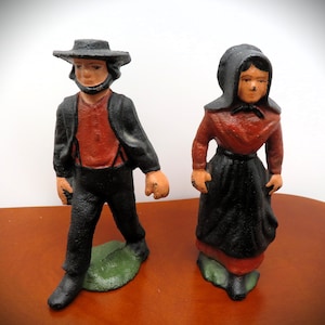 Vintage Cast Iron hand painted Amish Man and Woman Figurines