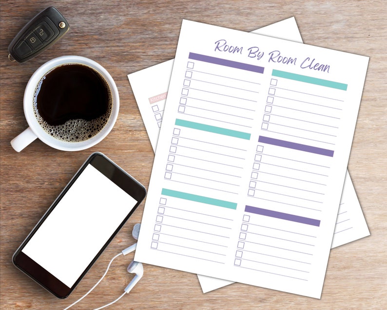 May include: Printable checklist with the title "Room By Room Clean" in purple and teal. The checklist has two columns with checkboxes and lines for writing tasks.