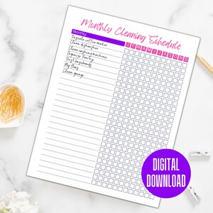 May include: A printable monthly cleaning schedule checklist with a purple and pink header. The checklist includes tasks such as descaling the coffee maker, cleaning the dishwasher, and cleaning the garage. The months of the year are listed across the top of the checklist.