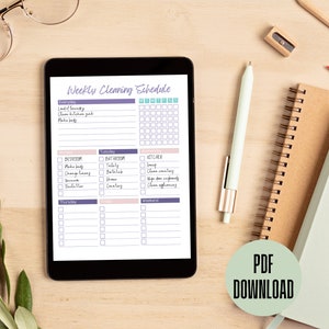 May include: A digital tablet displaying a weekly cleaning schedule with a checklist for everyday, Monday, Tuesday, Thursday, Friday, and Weekend. The schedule includes tasks for the kitchen, bedroom, and bathroom. The tablet is on a wooden surface with a pen, pencil, and a notebook.