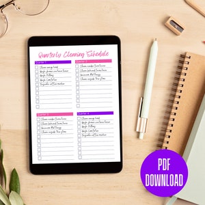 May include: A digital tablet displaying a printable cleaning schedule divided into four quarters. Each quarter lists cleaning tasks such as cleaning the range hood, washing pillows, and cleaning inside the glass.