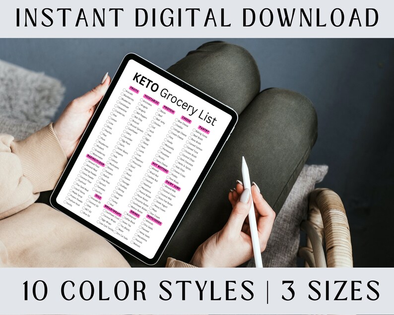 May include: A digital tablet displaying a Keto grocery list with checkboxes next to various food items. The list is organized into categories such as Fruits, Vegetables, Protein, Dairy, Nuts & Seeds, and more. The tablet is being held by a person's hands.