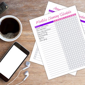 May include: A printable monthly cleaning schedule checklist with a purple and white color scheme. The checklist includes tasks such as cleaning the coffee maker, dishwasher, washing machine, pantry, and garage. The schedule is organized by month and includes a grid for checking off tasks.