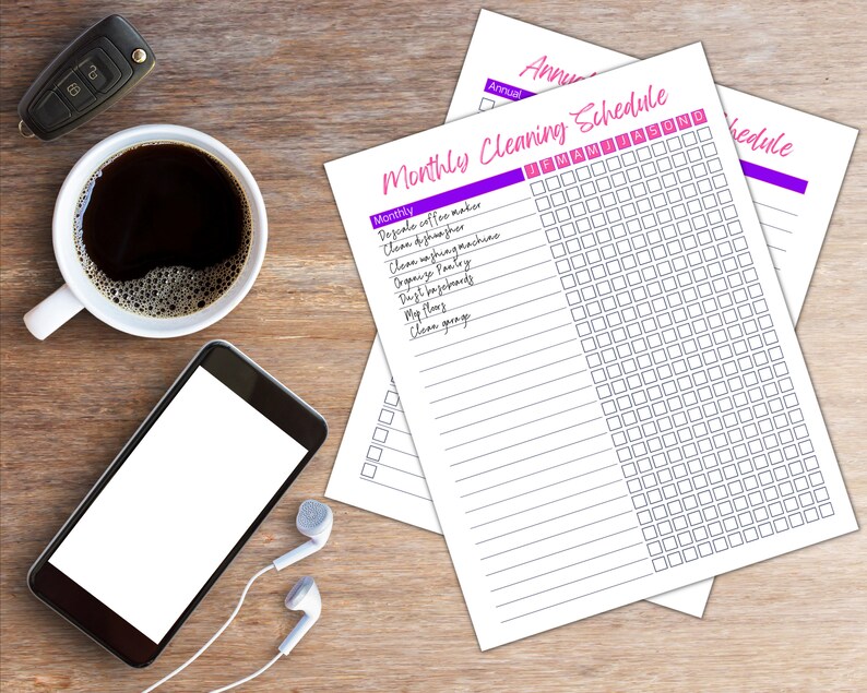 May include: A printable monthly cleaning schedule checklist with a purple and white color scheme. The checklist includes tasks such as cleaning the coffee maker, dishwasher, washing machine, pantry, and garage. The schedule is organized by month and includes a grid for checking off tasks.