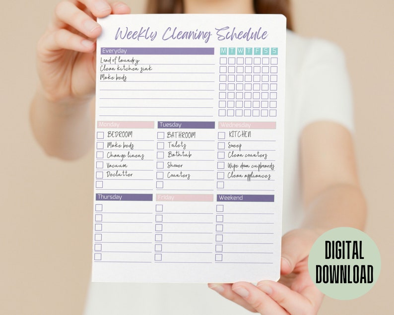 May include: A printable weekly cleaning schedule checklist with a purple and pink color scheme. The checklist includes daily, weekly, and specific room cleaning tasks. The text on the checklist includes "Weekly Cleaning Schedule", "Everyday", "Monday", "Tuesday", "Wednesday", "Thursday", "Friday", "Weekend", "Bedroom", "Bathroom", "Kitchen", "Load of Laundry", "Clean Kitchen Sink", "Make Beds", "Tidy", "Bathtub", "Shower", "Counters", "Sweep", "Clean Counters", "Wipe Down Cupboards", "Clean Appliances", "Change Linens", "Vacuum", "Declutter".
