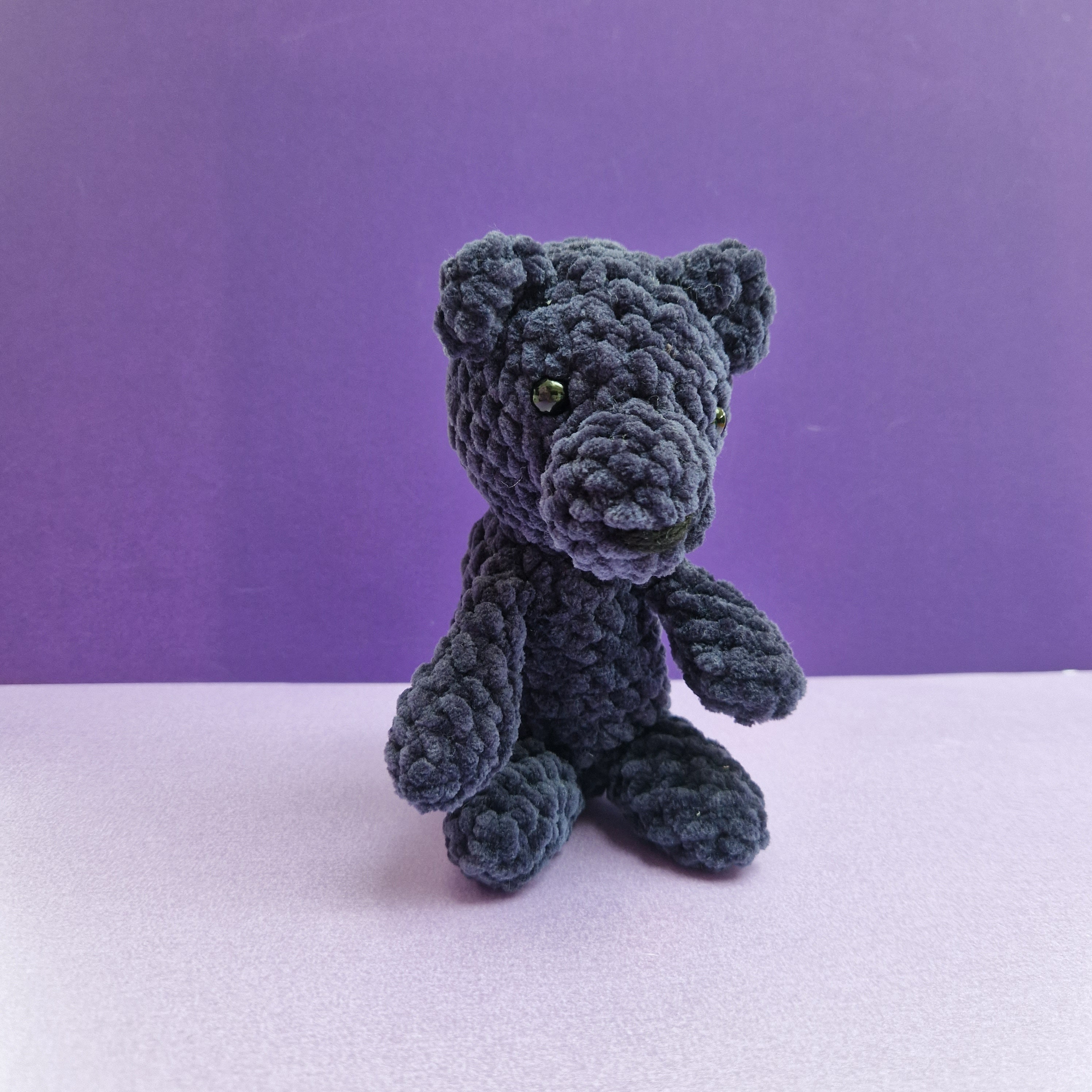 Navy blue sitting bear made with chenille super soft yarn and safety eyes