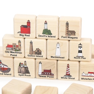 May include: Wooden blocks featuring colorful illustrations of various lighthouses, including Big Red, Devil's Island, and Fort Niagara. Each block displays a unique lighthouse design with its name, perfect for educational play or decor.