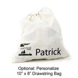 May include: An off-white cotton drawstring bag featuring a green logo with the text Everwood friends and a silhouette of two children. The name Patrick is printed in black text on the front. The bag measures 10 inches by 8 inches in size.