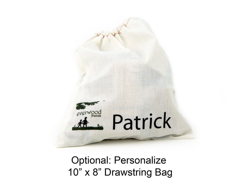 May include: An off-white cotton drawstring bag featuring a green logo with the text Everwood friends and a silhouette of two children. The name Patrick is printed in black text on the front. The bag measures 10 inches by 8 inches in size.