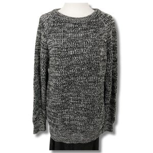 May include: A black and white speckled sweater with a crew neck.