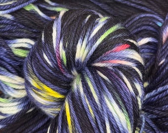 Hand dyed 100% fine merino superwash yarn in "Light Bright", DK weight, Multicolored, Black, Rainbow colorway