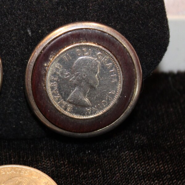 Round statement earrings in silvertone and brown leather, features a foreign coin as the centerpiece. - Unsigned