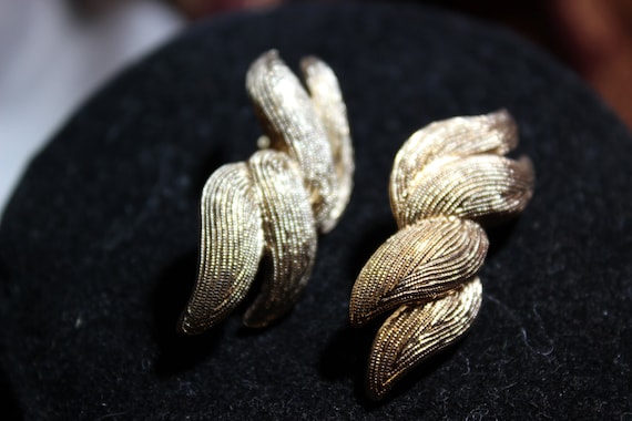 MONET - Rubbed Gold clip on earrings signed by Monet
