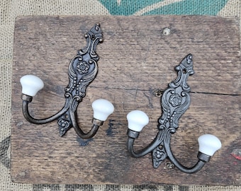 The French Style Double Robe cast iron hook with an Antique Iron or Antique Copper finish and Hook with Ivory ceramic ball tips