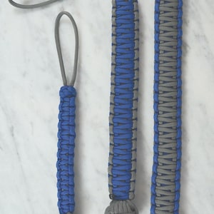 May include: Three handmade paracord items in royal blue and gray. The items include a small keychain, a medium-sized lanyard, and a longer lanyard. The text "RainyDayzArt" and "Royal Blue & Gray" are visible.