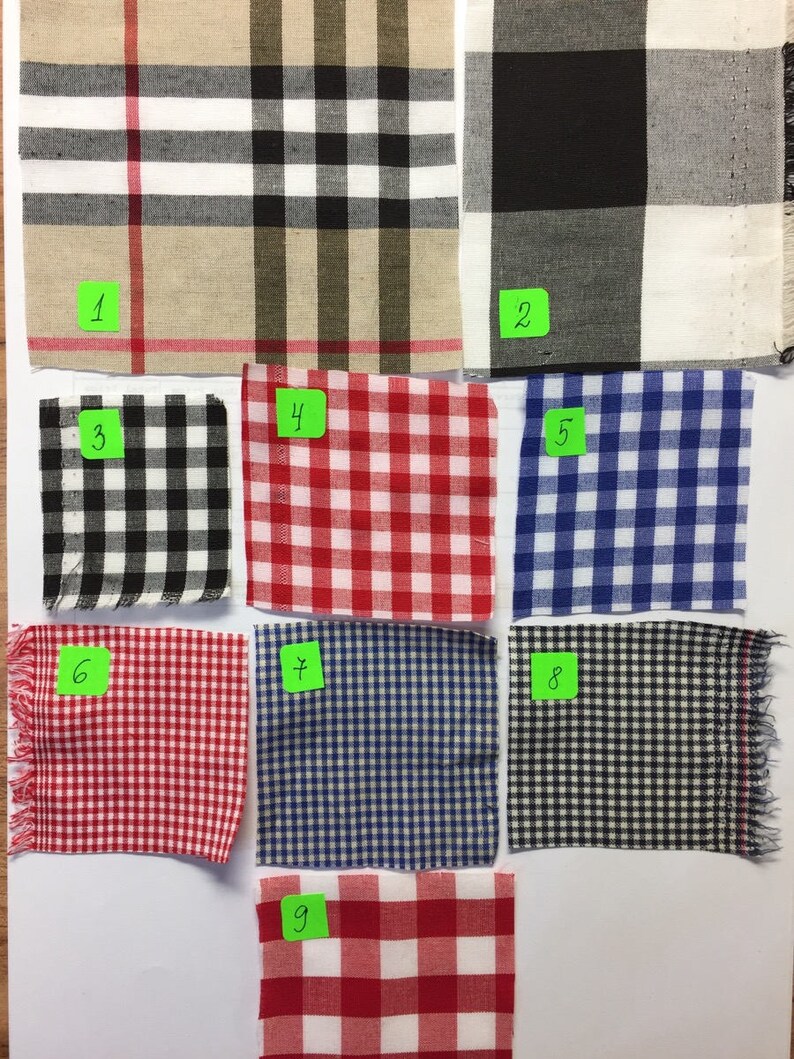 May include: Nine fabric swatches with various plaid patterns. The swatches are numbered 1 through 9. The swatches are arranged in three rows of three. The swatches are all different colours and patterns.