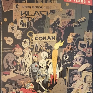 May include: A Dark Horse Comics cover celebrating 20 years, featuring characters and logos. The artwork includes Conan, Sin City, and other comic book figures. The colour scheme is predominantly black, brown, and beige, with various text elements.