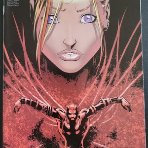 May include: Comic book cover art featuring a woman with blonde hair and purple eyes, and a man with a red background. The title of the comic is "FATHOM DAWN of WAR".