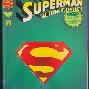 May include: A vintage Superman comic book with a green background. The cover features the title "Reign of the Supermen!" and "Superman in Action Comics." The Superman logo is prominently displayed. The text "The Last Son of Krypton is Back!" is also visible.