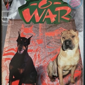 May include: A comic book cover featuring a red and green title "Dogs of War" with a black and white illustration of a dog wearing armor. The cover also features a red and white illustration of a dog with a red and white background. The cover also includes the text "All Nude Variant Cover".