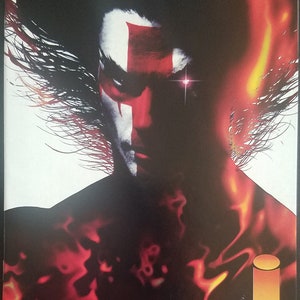 May include: A comic book cover featuring a red and white illustration of a man with a cross on his forehead. The background is a fiery orange and red. The title of the comic is "HELLSHOCK" and the artist is "JAE LEE".