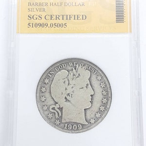 May include: A silver 1909-S Barber half dollar coin in a plastic coin holder. The coin is graded by SGS and has a certification number of 510909.05005. The coin features a profile of Liberty with the inscription "In God We Trust" and "1909".