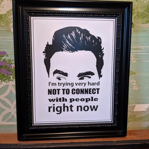 May include: Black and white framed print with a silhouette of a person's head and the text "I'm trying very hard NOT TO CONNECT with people right now".