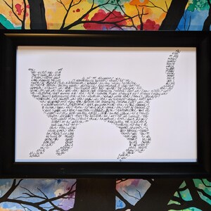 May include: A framed black and white print of a cat silhouette made of handwritten text. The text is in a cursive font and fills the entire silhouette of the cat.
