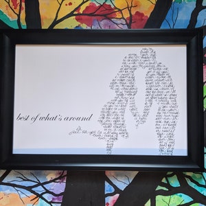 May include: A framed print with a black and white silhouette of two people embracing. The silhouette is made up of words, and the text "best of what's around" is written at the bottom of the print.