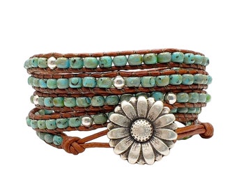 Turquoise Seed Bead and leather wrap bracelet using Silver Spacer Beads and a Daisy Button Closure.