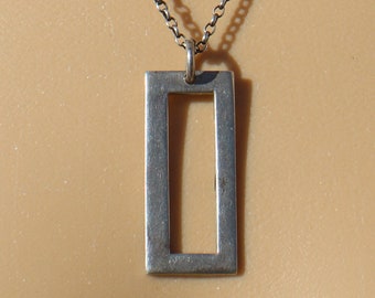 Sterling Silver Pendant: Modern, contemporary, sterling silver rectangular pendant on sterling silver rolo chain on 18” length. 10675