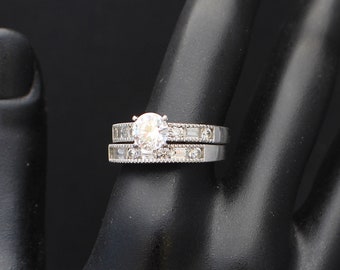 CZ Wedding Ring Set: Traditional engagement, wedding, of sterling silver with Cubic Zirconia large stone and surrounding stones.  3394