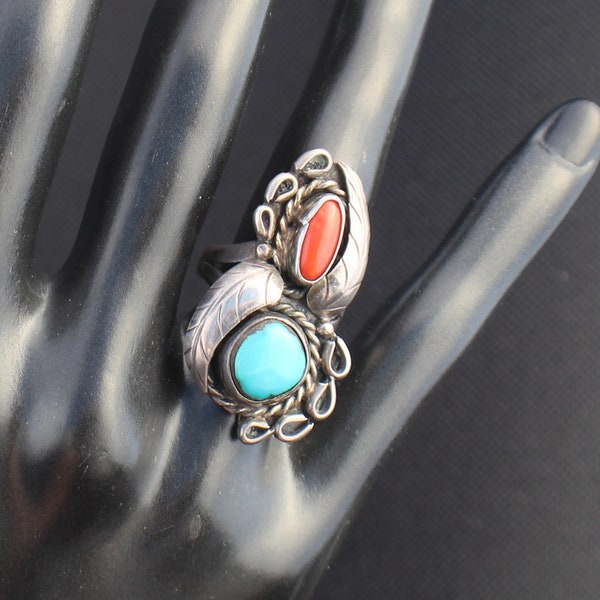 Native American Ring:  Hallmarked sterling  ring, with round Kingman turquoise, red coral stones and feather accents in size 7.5. 10891 AW