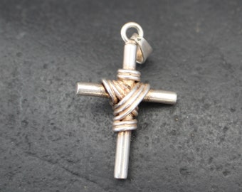 Rustic, sterling silver Christian cross, with heavy wire strands around center section in size 1 1/2 inch by 1 inch.  Jesus Calvary 10483