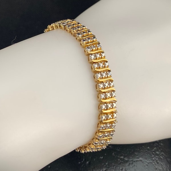 Sterling Gold tone Tennis Bracelet: Sterling silver chain link bracelet with round  CZ’s, Cubic Zirconias. Stamped SEVA 925. 11648