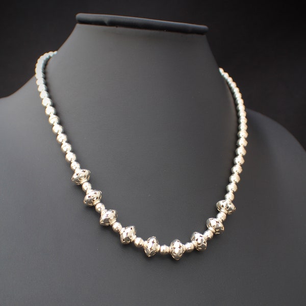 Southwest style Sterling silver beaded necklace  with saucer and ball shaped beads and cut outs. Handmade and Hallmarked  0157 AW