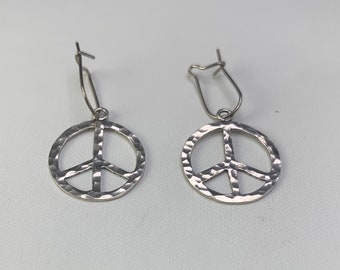 Sterling Silver PEACE symbol earrings:  Small hoop sterling silver PEACE SYMBOL earrings hanging on wire clasps for male or female. 11938