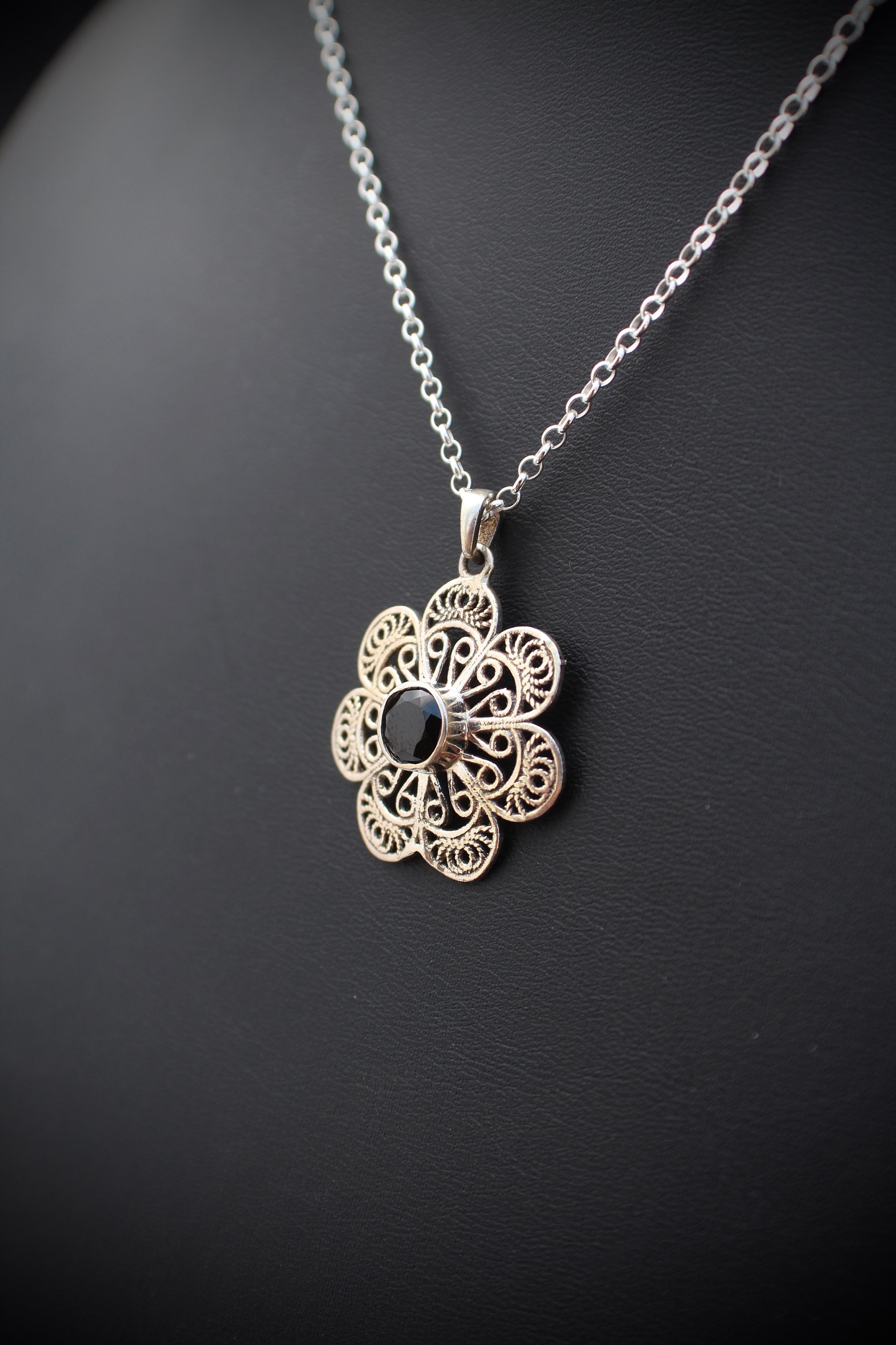 Silver Flower Pendant: With Round Shaped Faceted Onyx Black